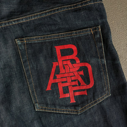 JEANS BAPE ROSSI CON LOGO E TASCA POSTERIORE [W32]